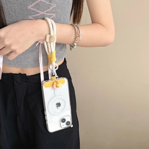 Close-up of cream braided phone lanyard with a smiley face charm and yellow connector card