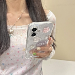 Glitter iPhone case with 3D pink star and purple fish resin charms held by model