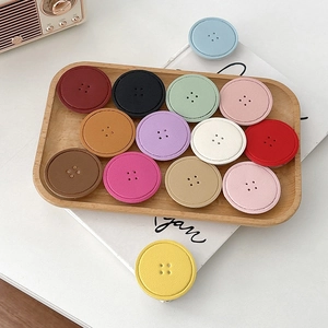 Collapsible round leather texture button phone grips in assorted colors for smartphones