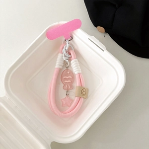 Pink woven phone charm featuring a translucent fish pendant and a cute star detail