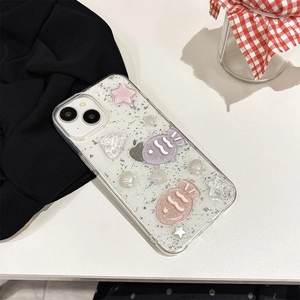 Detail of glittery iPhone case with 3D fish, stars, and sea shell decorations