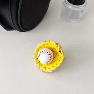 Detail of yellow baseball glove phone grip with white ball and red stitching texture