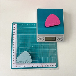Detailed view of leather triangle phone grip weight 9.6g and size 5cm x 4.5cm
