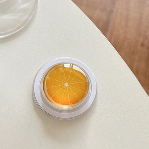 Detailed top view of a 3D realistic orange slice phone grip with glossy resin finish