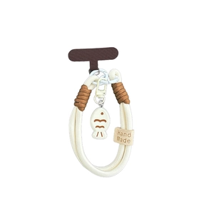 Handmade woven wrist strap with a cream fish pendant and Hand Made label for phone or keys