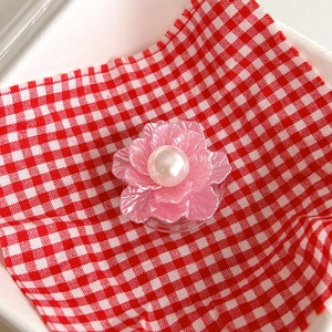 Detailed macro view of pink pearl flower phone socket with 3D translucent petals