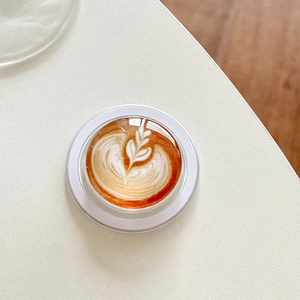 Close-up of 3D resin phone socket with realistic latte art and glossy finish