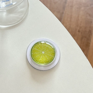 Detail of green lime fruit slice phone socket with glossy clear resin coating