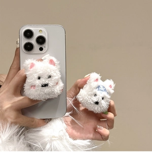 Detail of white plush puppy phone socket with soft faux fur texture and pink inner ears