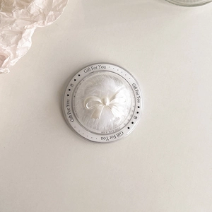 Close-up of pearl bow phone grip in a transparent Gift For You round gift box