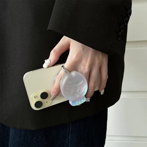 Close-up of translucent iridescent laser fish phone grip on a white iPhone held by a hand