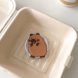 Close-up of cute cartoon capybara acrylic phone grip with strong magnetic suction back