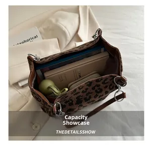 Interior view showing large capacity of the leopard print canvas tote bag with daily items