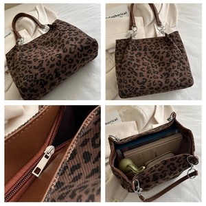 Detail view of leopard print corduroy tote bag showing large capacity and zipper texture