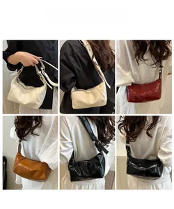 Detailed views of vintage oil wax leather crescent bags in various colors on models