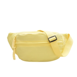 Minimalist pale yellow nylon crossbody bag with adjustable wide shoulder strap and zippers