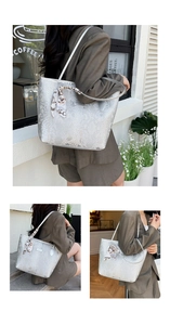 Silver snakeskin tote bag with elegant silk scarf detail and spacious urban style