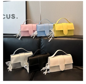 Detailed display of candy-colored crossbody bags with pearl charms in six vibrant shades