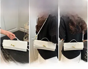 Three-way carry demonstration of white crocodile embossed baguette bag with gold horn lock