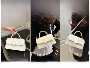 Three-way carry demonstration of white leather flap bag: handheld, crossbody, and shoulder