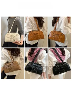 Detailed views of the lace-up underarm bag in beige, caramel, and black colors
