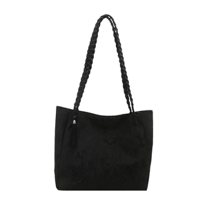 Black tote bag with butterfly embossing, woven handles and decorative tassel detail