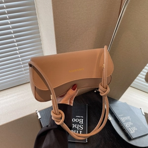 Minimalist beige PU leather shoulder bag with decorative knotted strap for summer fashion