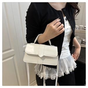 Elegant white leather crossbody bag shown on model for professional everyday styling