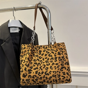 Leopard print corduroy tote bag with brown straps and chain detail for women