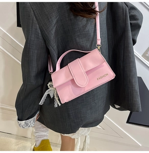 Pink rectangular crossbody bag with pearl lace charm and fashion gold lettering detail