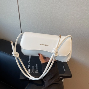 Minimalist white faux leather underarm bag with knot strap and metallic caps