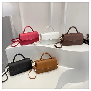 Group display of chic square handbags in five colors on a minimalist display stand