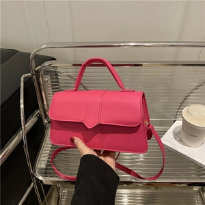 Elegant hot pink mini handbag with top handle and adjustable strap for women