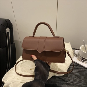Elegant brown minimalist crossbody bag with top handle and rectangular buckle design