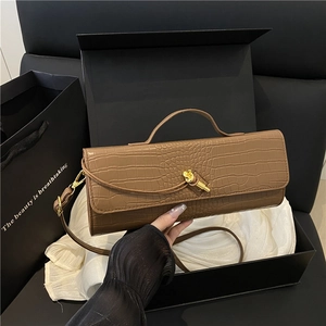 Brown crocodile embossed rectangle handbag with gold clasp and elegant hand-held grip