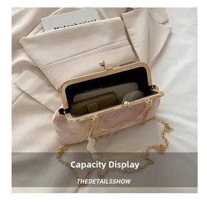 Top view of pink jacquard bag showing interior capacity for phone and cosmetics