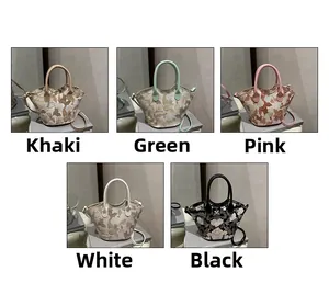 Detail view of stylish trapezoid bucket bags with floral embroidery in five colors