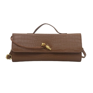 Brown crocodile embossed evening bag with knot lock and golden hardware detail