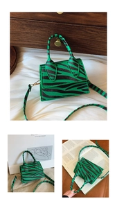 Detail of mini zebra print crossbody bag in green and black with detachable strap