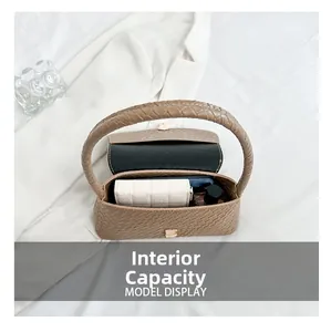 Top view showing the internal capacity of a brown woven baguette bag for phone and wallet