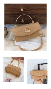 Detailed macro view of beige faux leather handbag with embossed crocodile texture