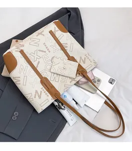 Large capacity hobo tote bag showing spacious interior with tablet and cosmetics