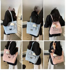Detail shots of large fabric tote bag with cloud charm and butterfly buckle in blue and pink