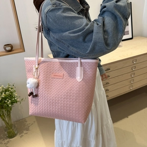 Pink woven PU leather tote bag with fashion label and cute white plush charm accessory