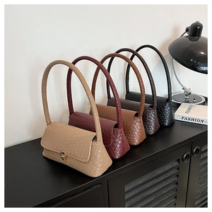 Detailed collection of textured shoulder bags in five colors with metal clasp closure