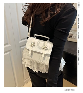 Chic white PU leather small square bag with star metallic accents on model display