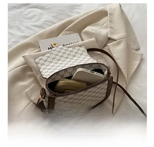 Internal view of the vintage crossbody saddle bag showing space for a phone and wallet
