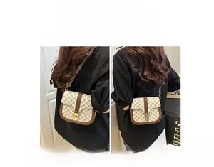 Detail view of the retro flap saddle bag showing shoulder and crossbody styling options