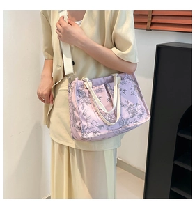 Detail of lavender tote bag with gray bamboo leaf prints and off-white wide strap