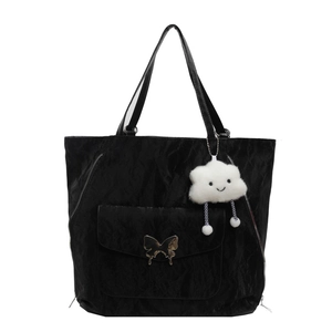 Large capacity black tote backpack with butterfly metal detail and cloud plush charm